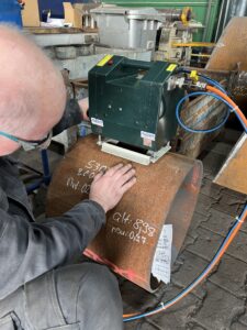 Man working with dot peen marker.
